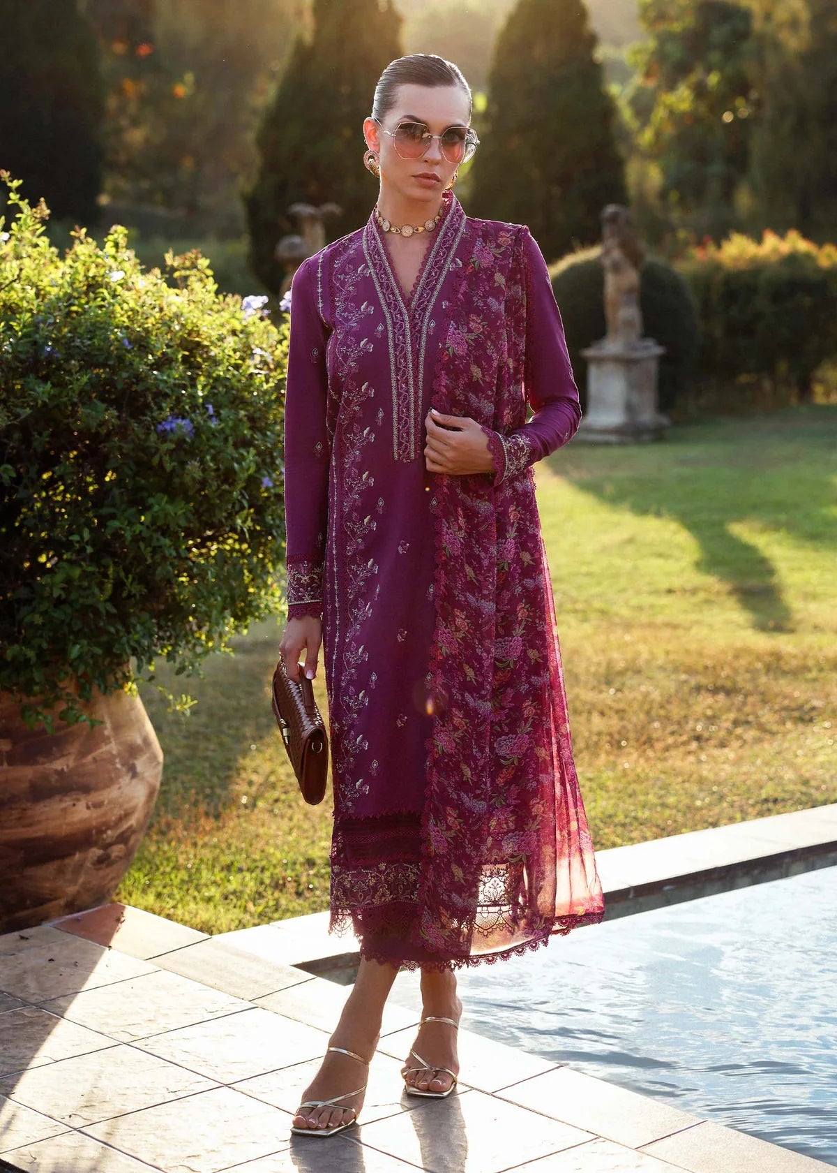 Model wearing deep magenta Alvina dress from Kanwal Malik Zaina Lawn '25, perfect Pakistani luxury pret for women shopping online in UK.