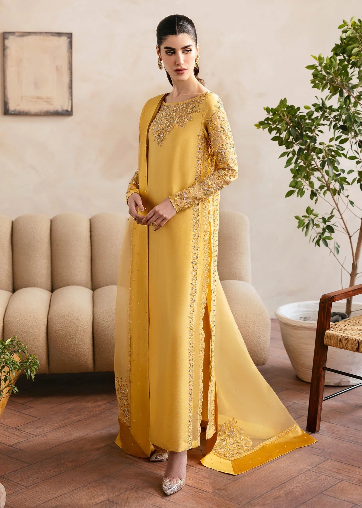 Model wearing Kanwal Malik Saesha yellow luxury pret dress. Shop Pakistani clothes online in the UK for elegant occasion wear.