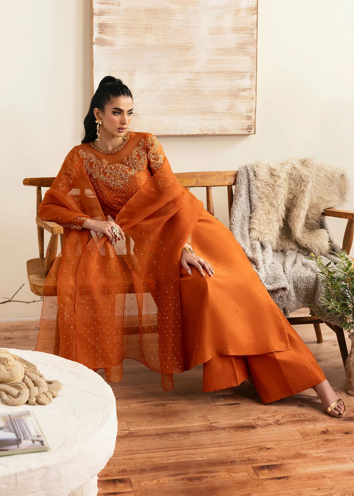 Model wearing Kanwal Malik Celina orange luxury pret dress. Shop Pakistani clothes online in the UK for festive and casual wear.