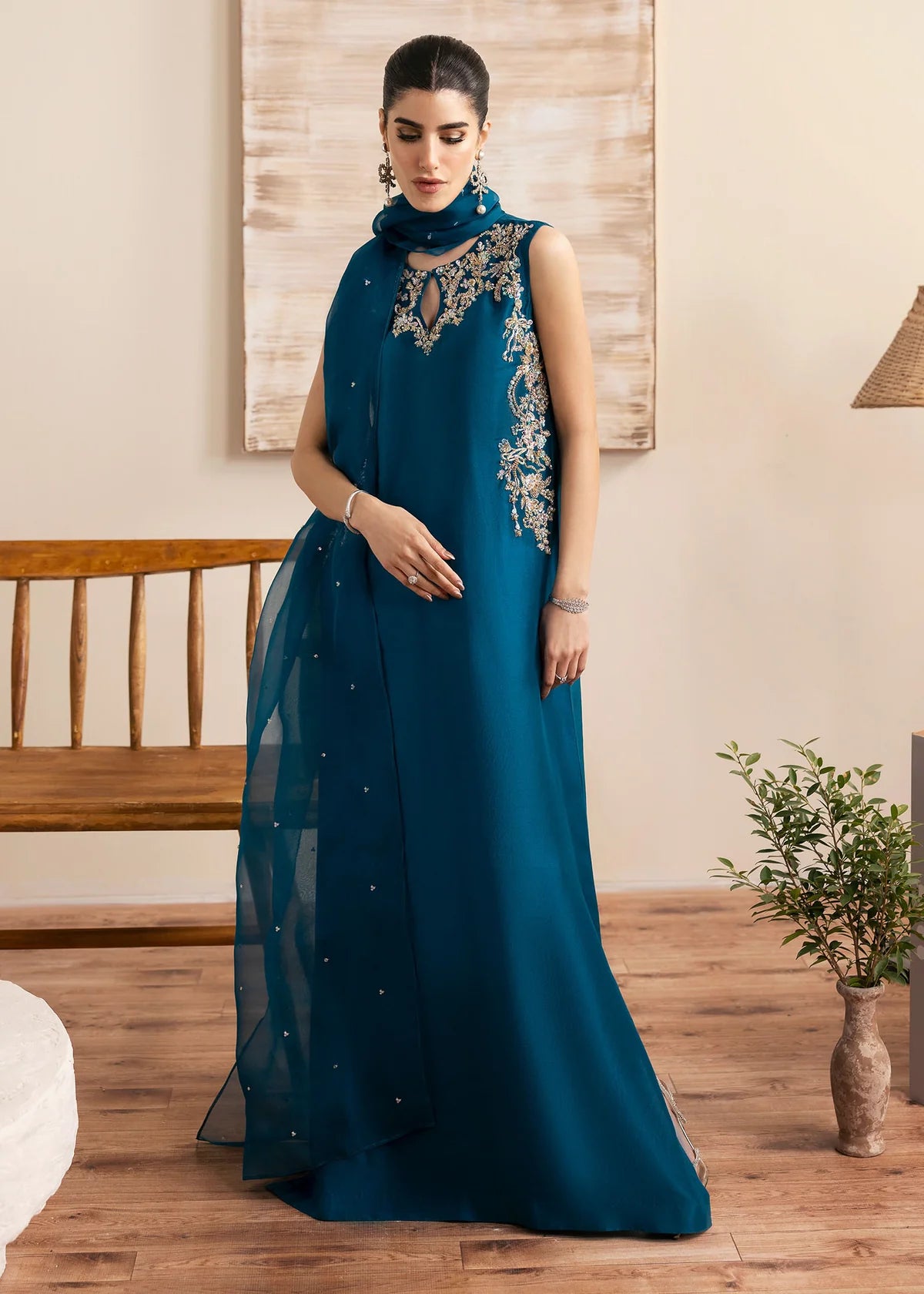 Model wearing Kanwal Malik Erina teal blue luxury pret dress. Shop Pakistani clothes online in the UK for festive and casual wear.
