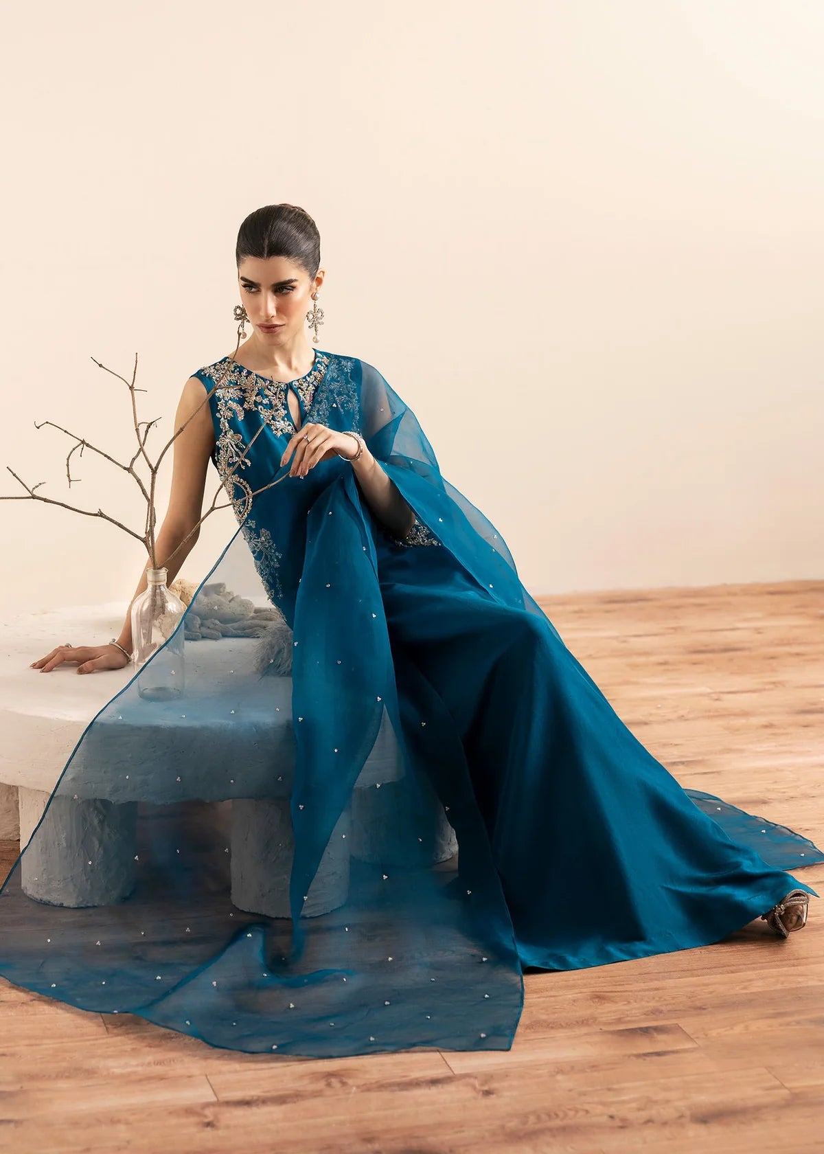Model wearing Kanwal Malik Erina teal blue luxury pret dress. Shop Pakistani clothes online in the UK for festive and casual wear.