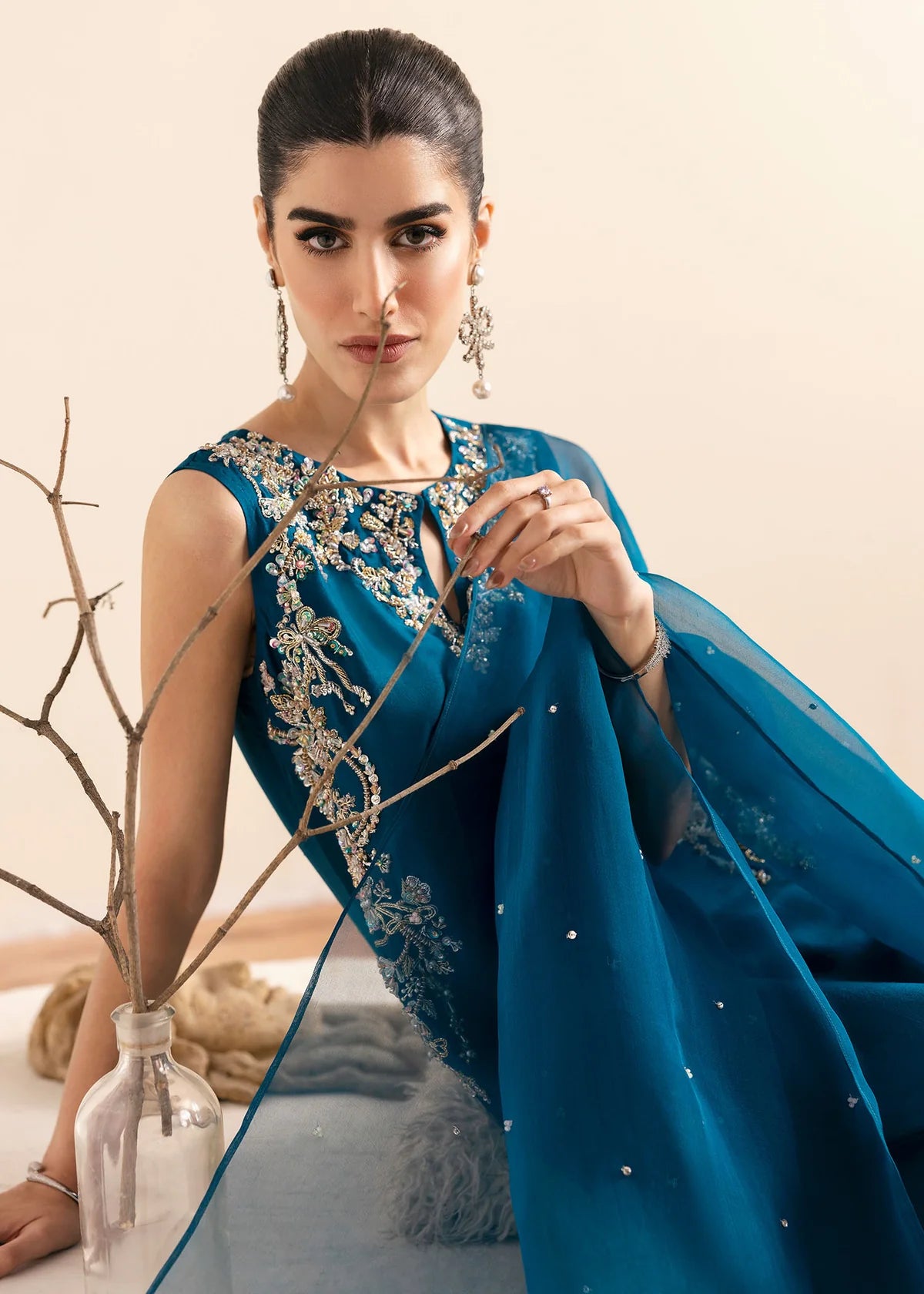 Model wearing Kanwal Malik Erina teal blue luxury pret dress. Shop Pakistani clothes online in the UK for festive and casual wear.