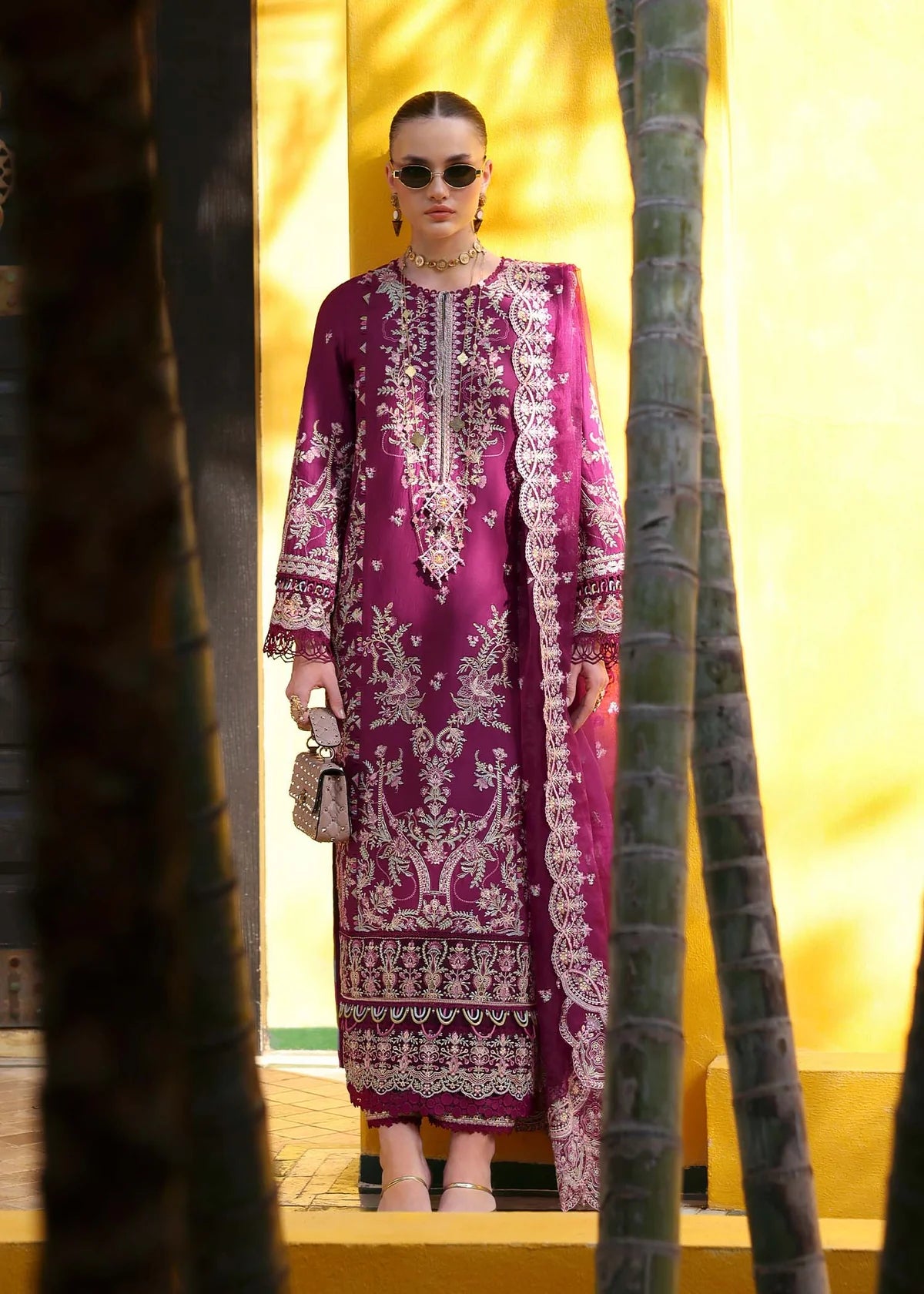 Model wearing deep magenta Lavena outfit from Kanwal Malik Elysia Luxury Lawn '25, ideal for Pakistani luxury pret and clothes online in UK.