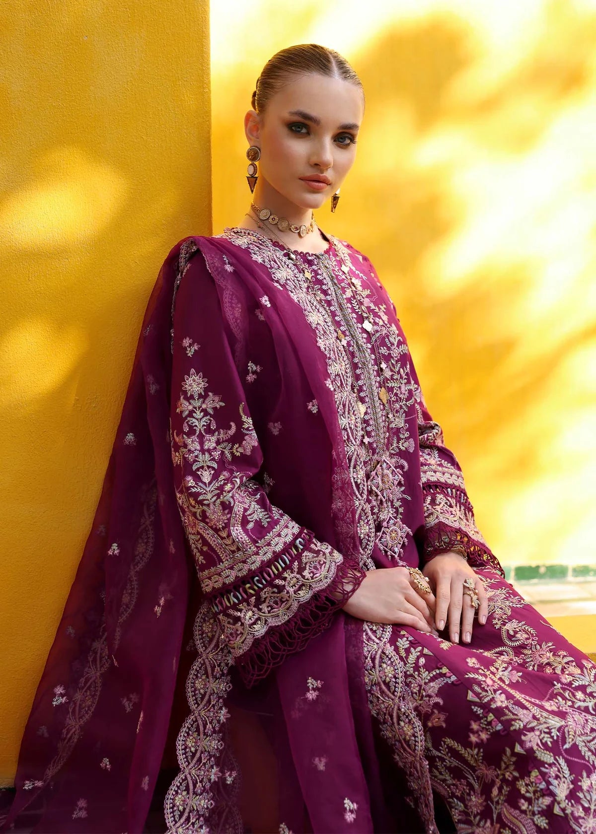 Model wearing deep magenta Lavena outfit from Kanwal Malik Elysia Luxury Lawn '25, ideal for Pakistani luxury pret and clothes online in UK.