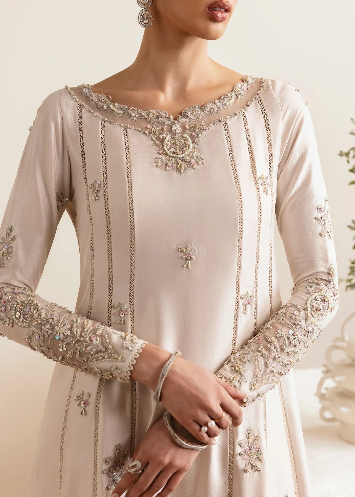 Model wearing Kanwal Malik Freya ivory embroidered luxury pret dress. Shop Pakistani clothes online in the UK for elegant occasion wear.