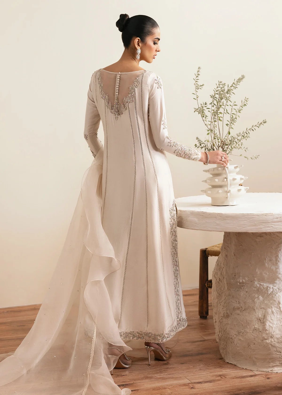 Model wearing Kanwal Malik Freya ivory embroidered luxury pret dress. Shop Pakistani clothes online in the UK for elegant occasion wear.