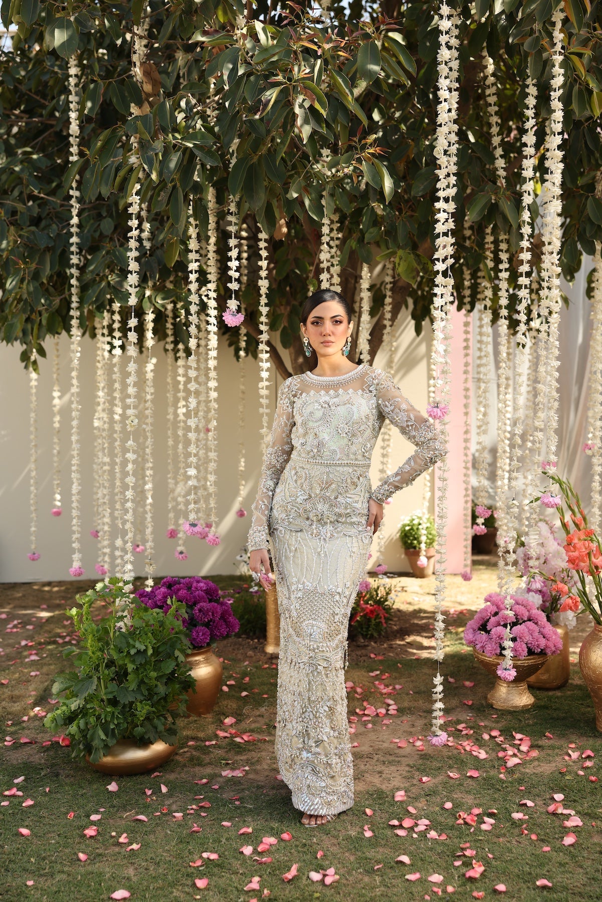 Model wearing ivory-beige full-length embellished dress with sheer sleeves from Mysie By Tahira’s Alma, Pakistani luxury pret clothes online in UK.
