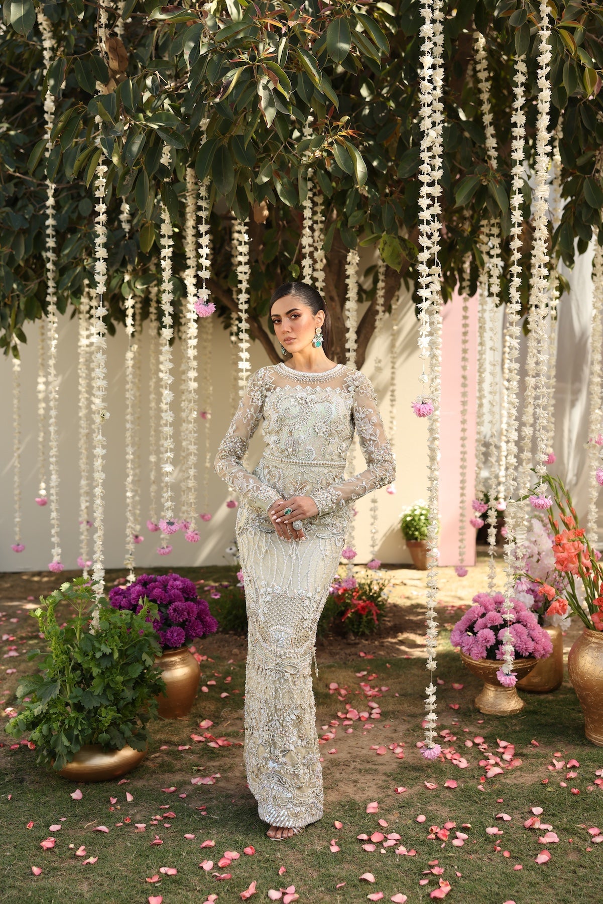 Model wearing ivory-beige full-length embellished dress with sheer sleeves from Mysie By Tahira’s Alma, Pakistani luxury pret clothes online in UK.