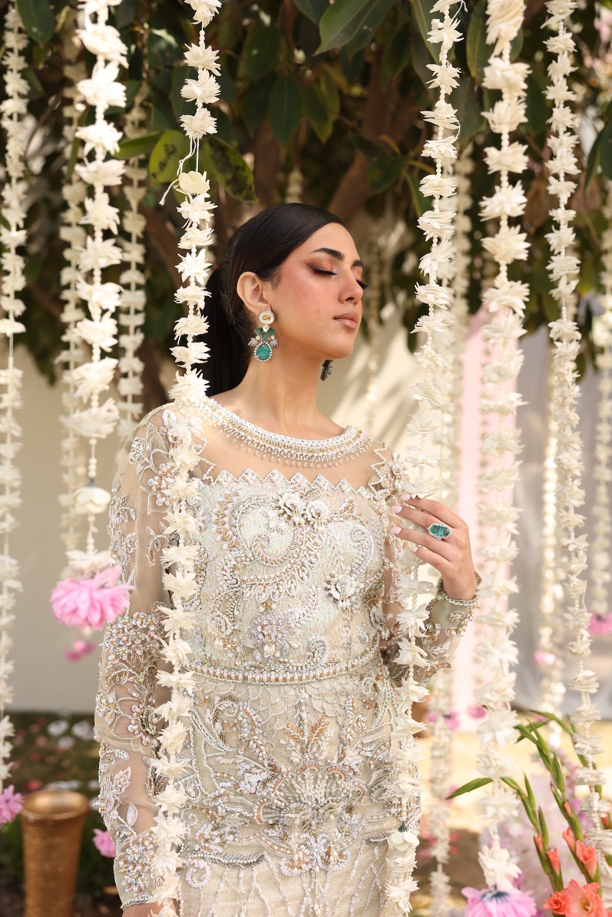 Model wearing ivory-beige full-length embellished dress with sheer sleeves from Mysie By Tahira’s Alma, Pakistani luxury pret clothes online in UK.