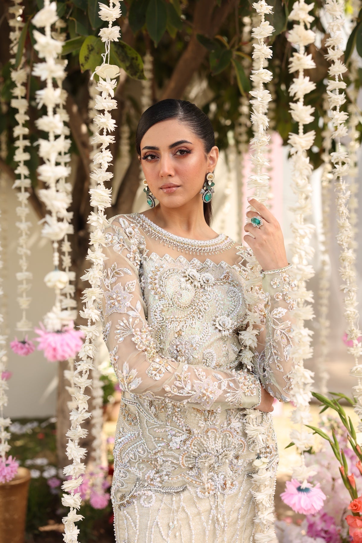 Model wearing ivory-beige full-length embellished dress with sheer sleeves from Mysie By Tahira’s Alma, Pakistani luxury pret clothes online in UK.