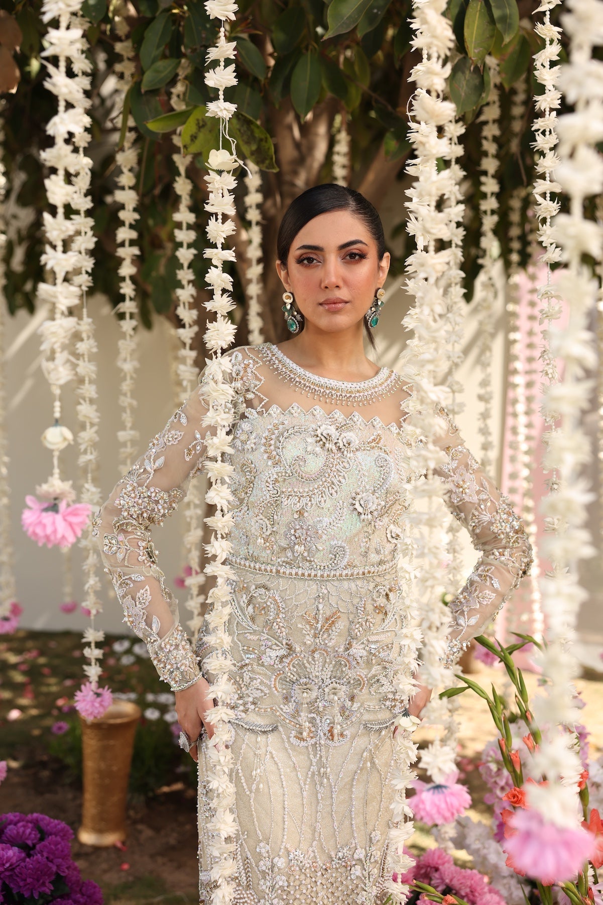 Model wearing ivory-beige full-length embellished dress with sheer sleeves from Mysie By Tahira’s Alma, Pakistani luxury pret clothes online in UK.