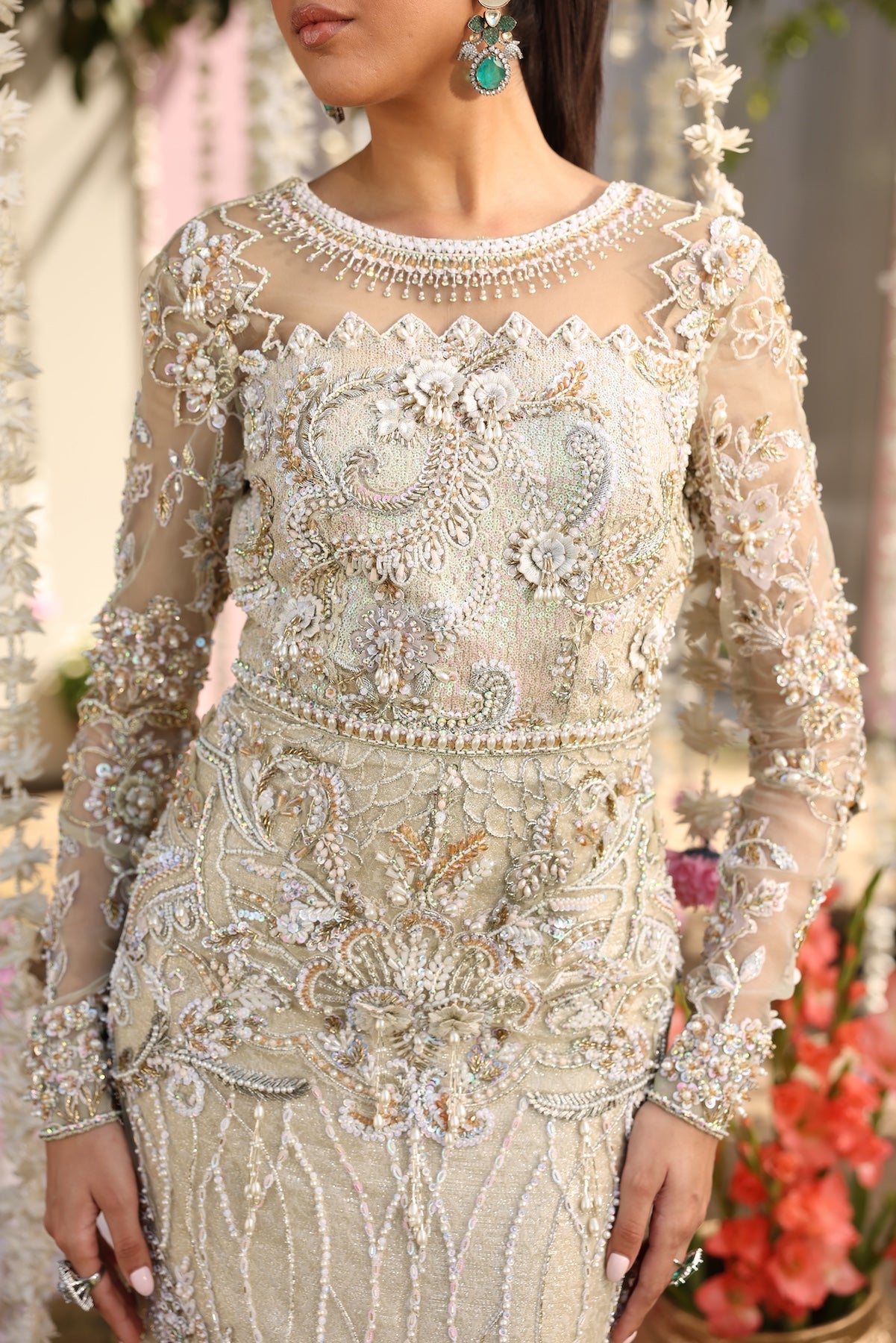 Model wearing ivory-beige full-length embellished dress with sheer sleeves from Mysie By Tahira’s Alma, Pakistani luxury pret clothes online in UK.