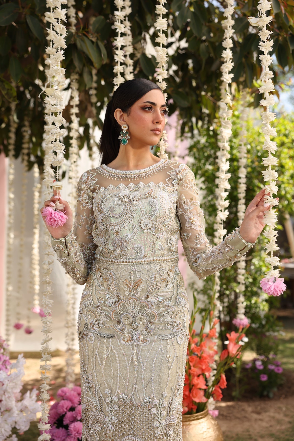 Model wearing ivory-beige full-length embellished dress with sheer sleeves from Mysie By Tahira’s Alma, Pakistani luxury pret clothes online in UK.
