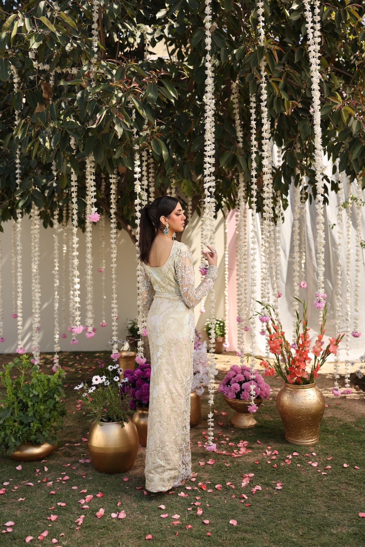 Model wearing ivory-beige full-length embellished dress with sheer sleeves from Mysie By Tahira’s Alma, Pakistani luxury pret clothes online in UK.