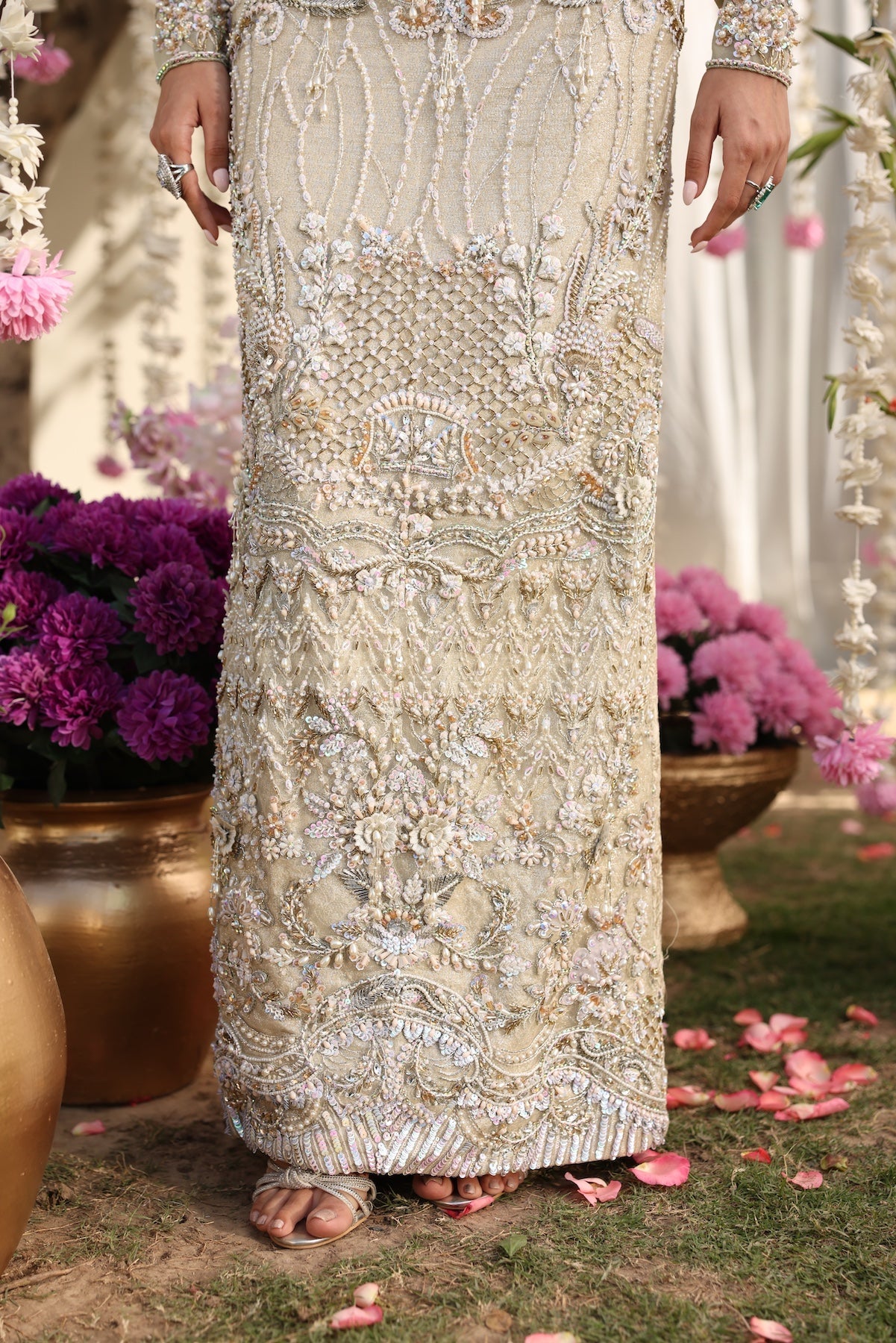 Model wearing ivory-beige full-length embellished dress with sheer sleeves from Mysie By Tahira’s Alma, Pakistani luxury pret clothes online in UK.