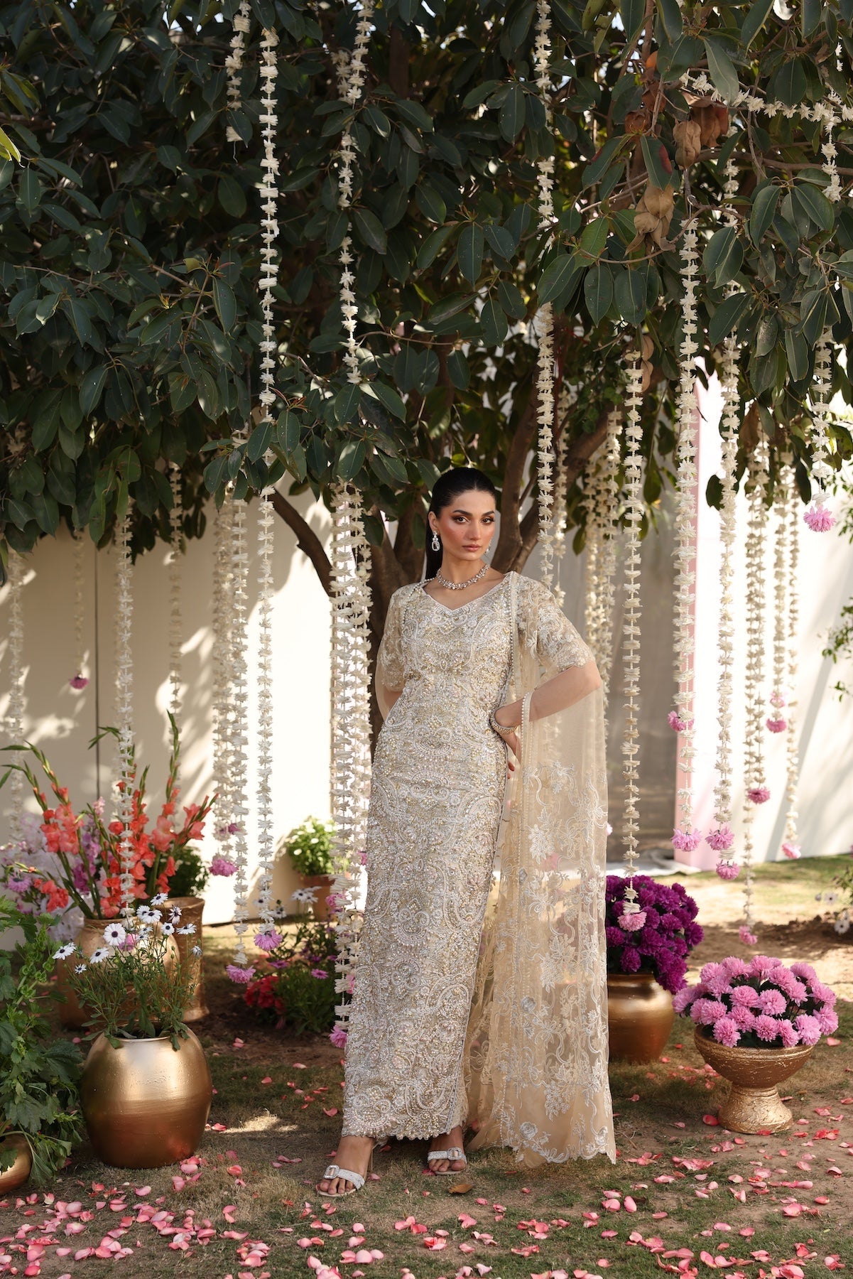Model wearing beige embellished straight-cut shirt with trousers from Mysie By Tahira’s Tessa, featuring intricate detailing, Pakistani luxury pret clothes online in UK.