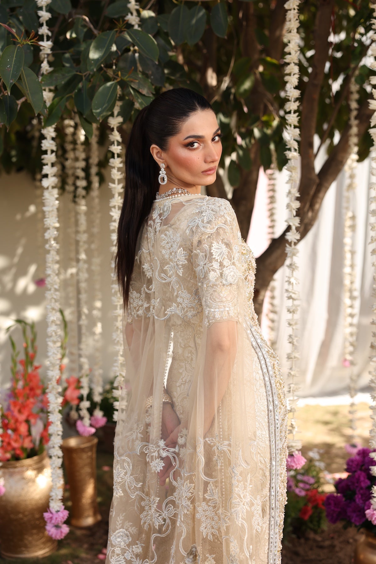 Model wearing beige embellished straight-cut shirt with trousers from Mysie By Tahira’s Tessa, featuring intricate detailing, Pakistani luxury pret clothes online in UK.