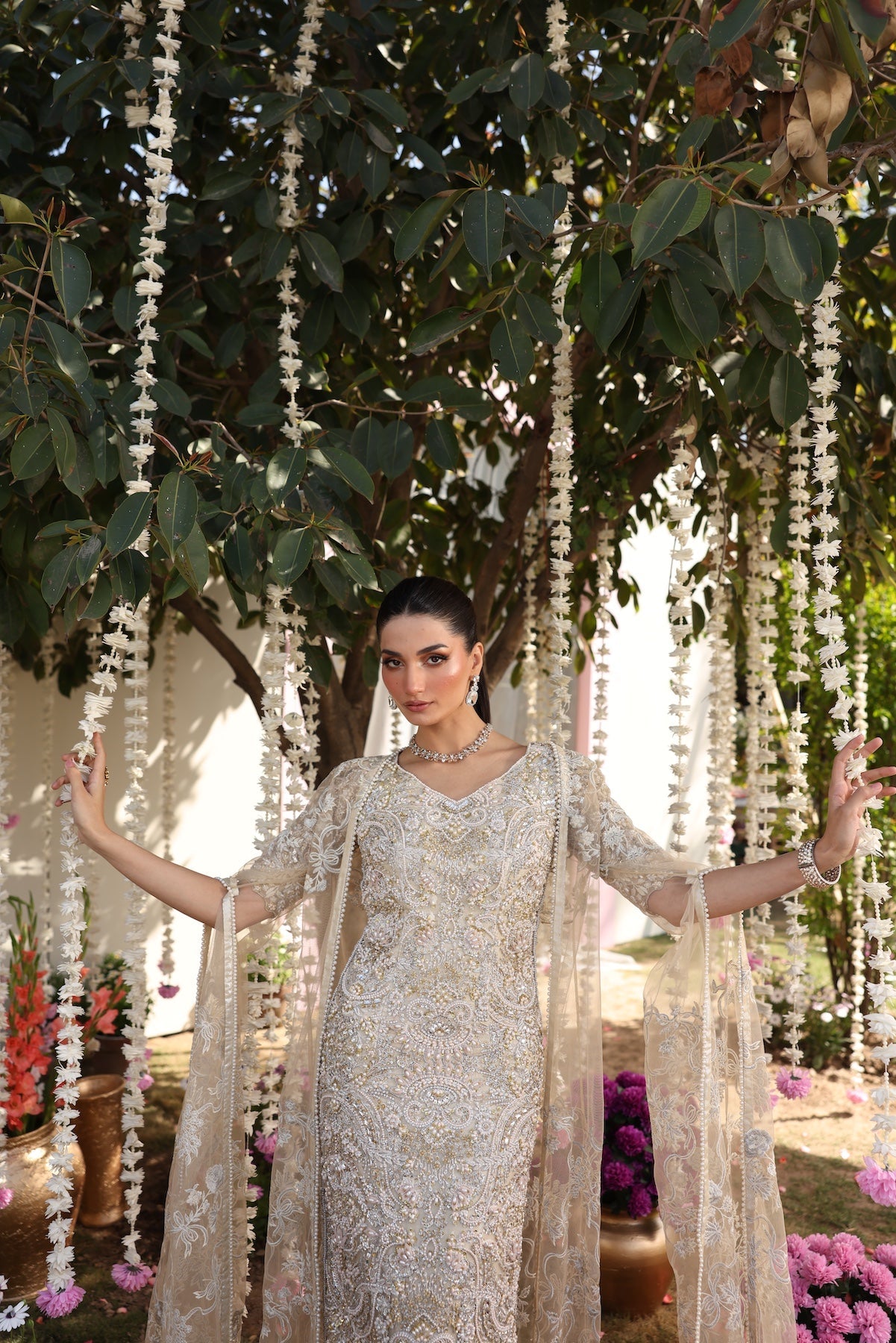 Model wearing beige embellished straight-cut shirt with trousers from Mysie By Tahira’s Tessa, featuring intricate detailing, Pakistani luxury pret clothes online in UK.