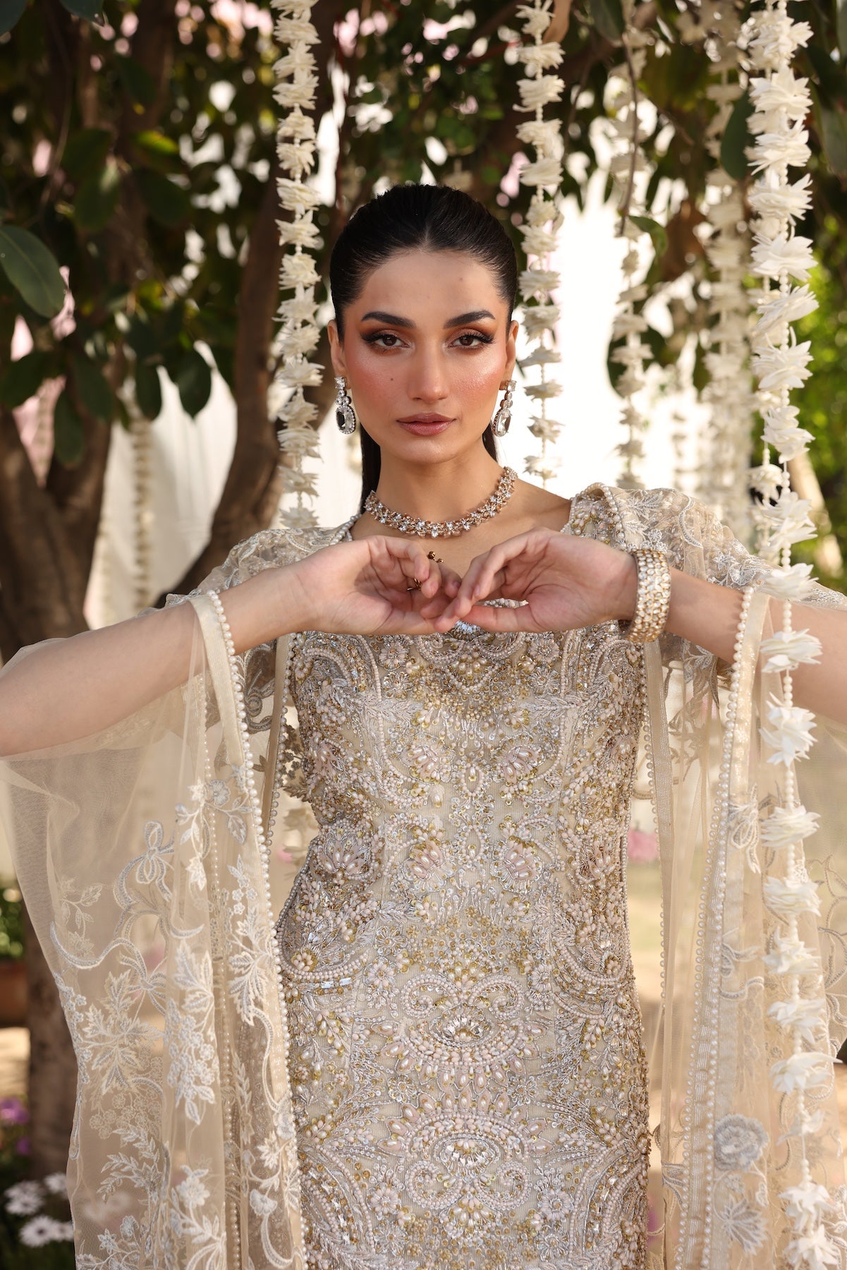Model wearing beige embellished straight-cut shirt with trousers from Mysie By Tahira’s Tessa, featuring intricate detailing, Pakistani luxury pret clothes online in UK.