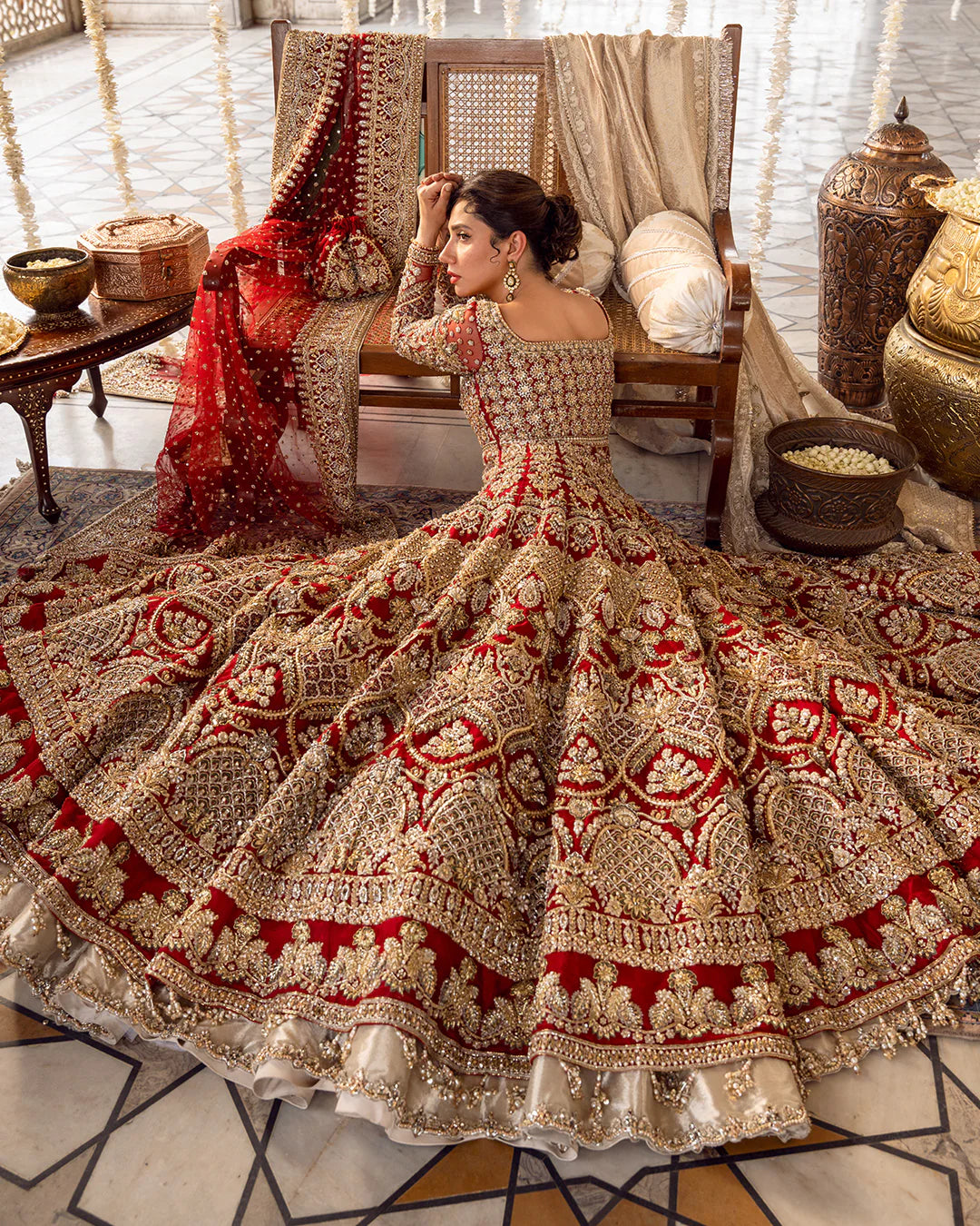 Model wearing deep red and gold bridal dress Juri by Faiza Saqlain, Pakistani luxury pret online in UK for weddings.