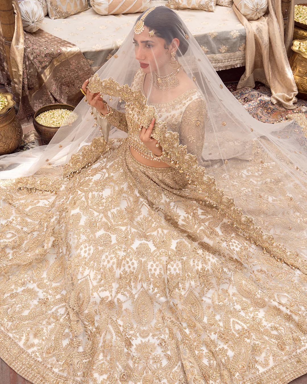 Model wearing cream and gold bridal dress Gelin by Faiza Saqlain, Pakistani luxury pret online in UK for wedding events.