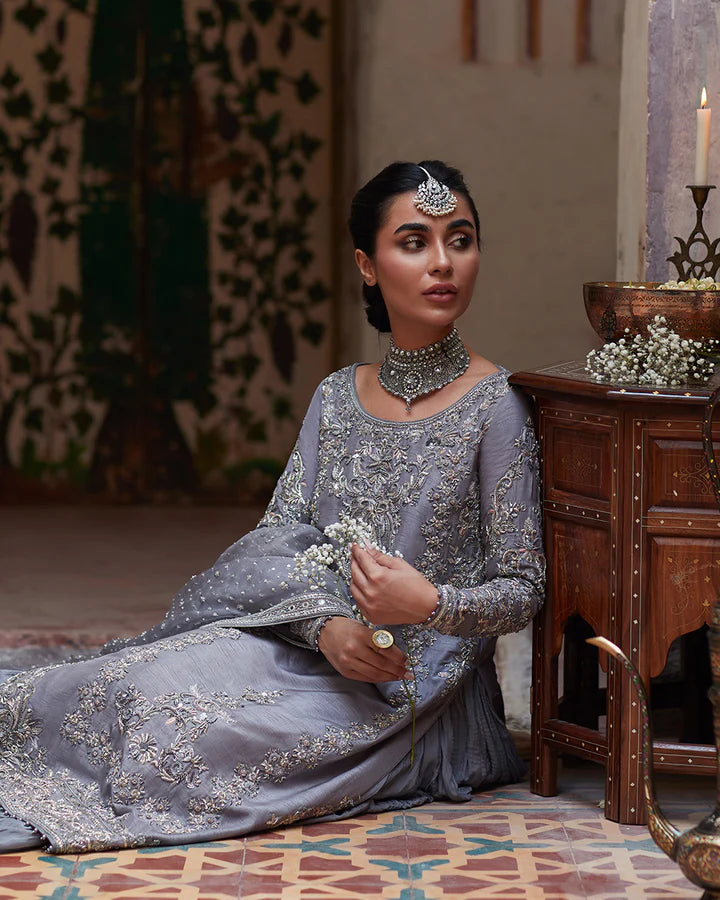 model wearing grey embroidered dress by Faiza Saqlain, Pakistani luxury pret available online in UK