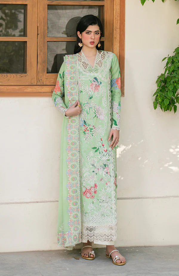 Model wearing mint green embroidered dress with floral detailing and lace hem from Soraya Noa Summer Casual Pret 2025 Willow. Pakistani clothes online UK.