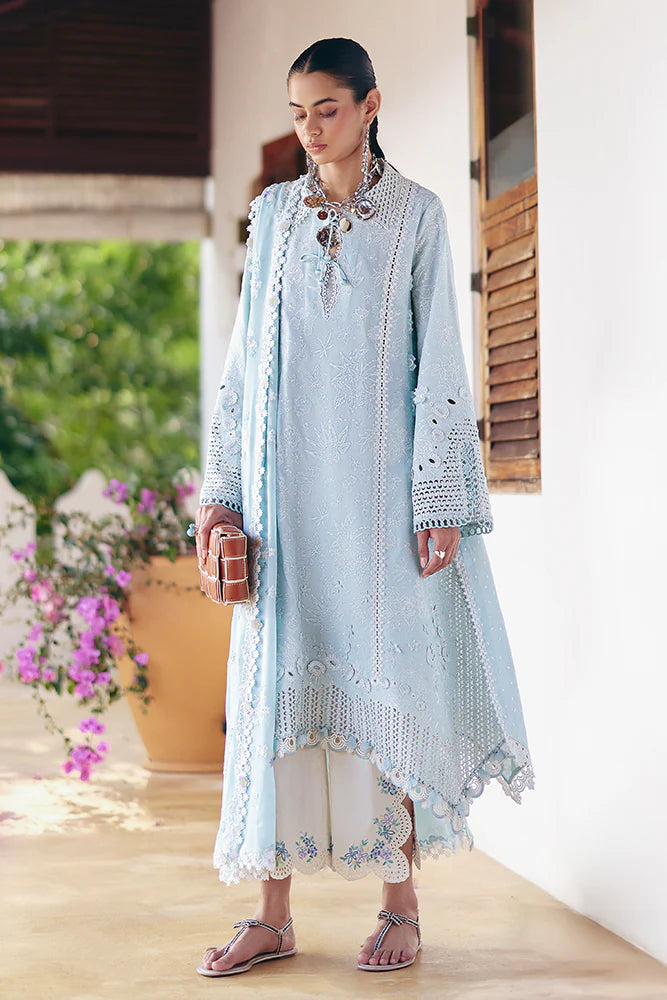 Model wearing pastel blue embroidered dress from Suffuse Casual Pret 2025 Zarina. Pakistani luxury pret and Pakistani clothes online in UK.