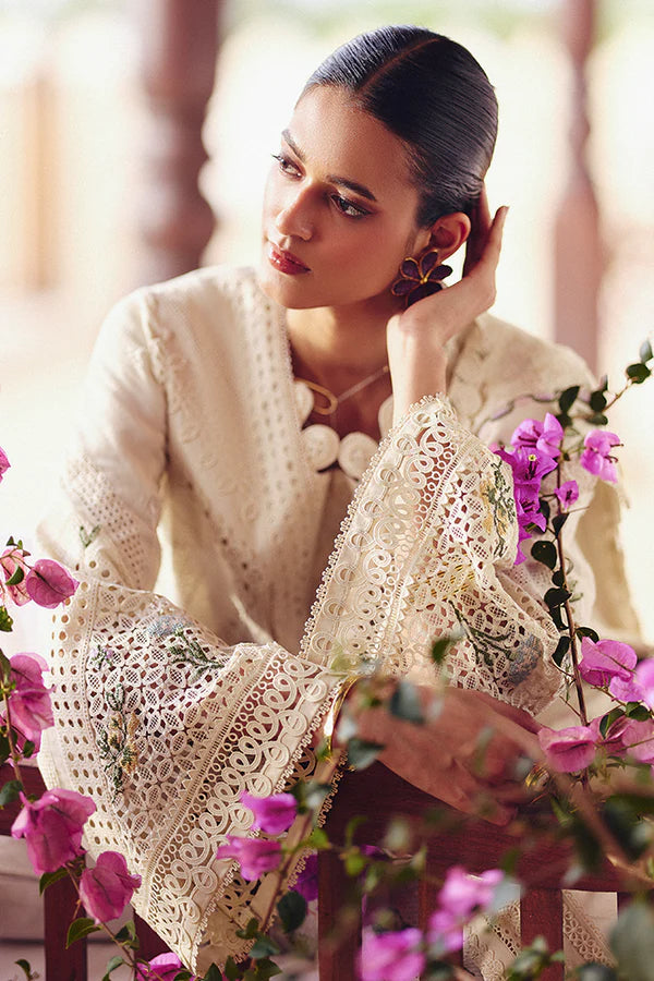 Model wearing off-white embroidered dress with delicate floral accents from Suffuse Casual Pret 2025 Afra. Pakistani luxury pret in UK.