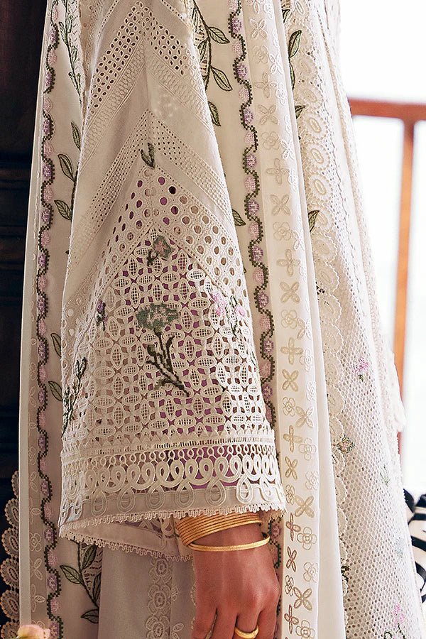 Model wearing off-white embroidered dress with delicate floral accents from Suffuse Casual Pret 2025 Afra. Pakistani luxury pret in UK.