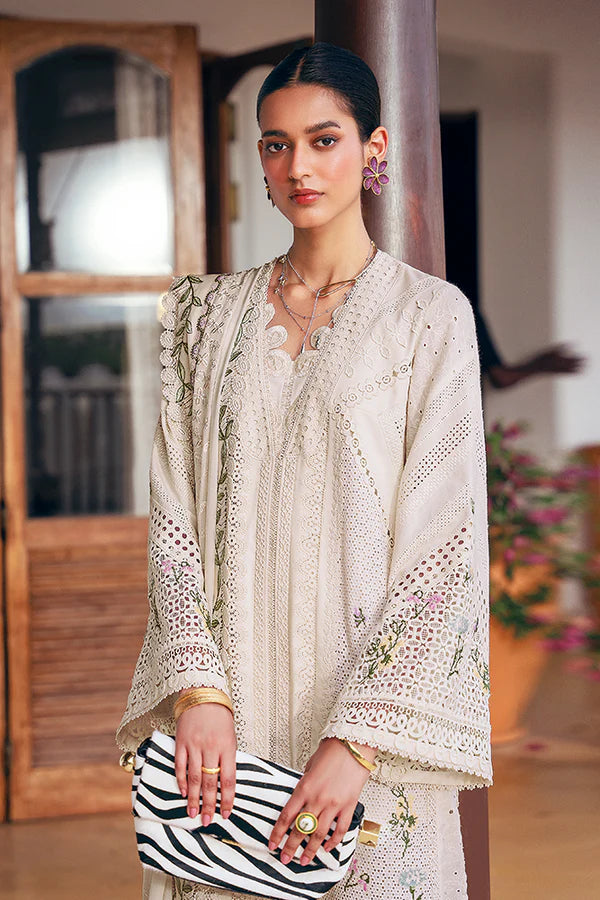 Model wearing off-white embroidered dress with delicate floral accents from Suffuse Casual Pret 2025 Afra. Pakistani luxury pret in UK.