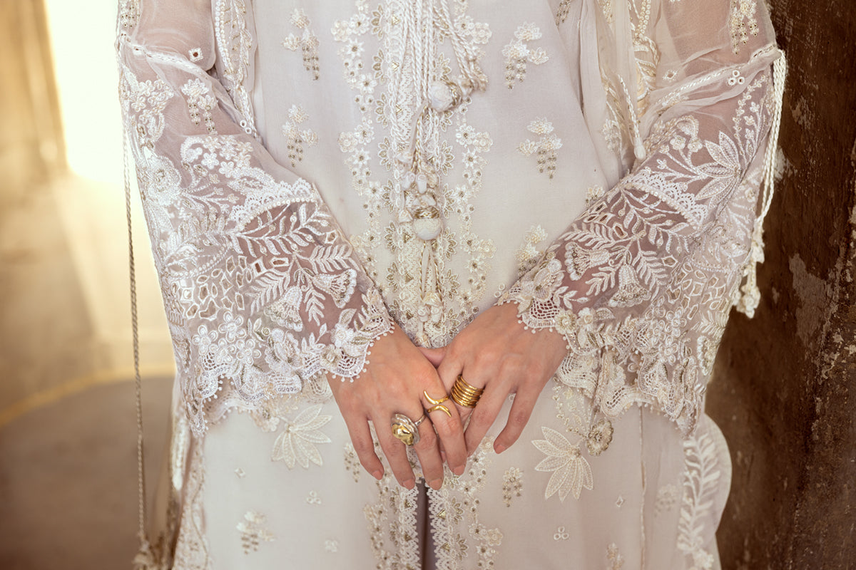 Model wearing ivory embroidered chiffon dress WC-03 ROISE from Qalamkar, perfect for Pakistani luxury pret and Pakistani clothes online in UK.
