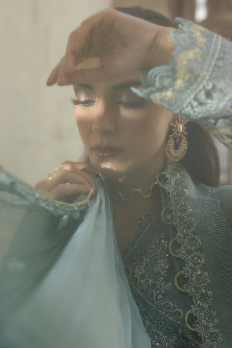 Model wearing powder blue embroidered chiffon dress WC-08 VEVIN from Qalamkar, Pakistani luxury pret available online in UK.