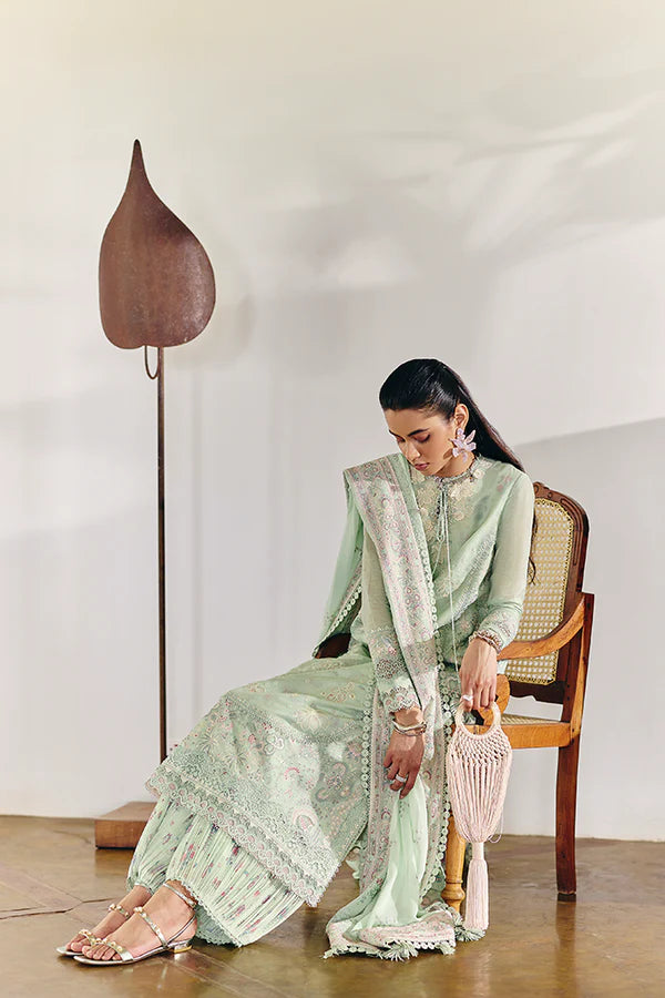 Model wearing pastel mint green embroidered dress from Suffuse Casual Pret 2025 Naire. Pakistani luxury pret and Pakistani clothes online in UK.