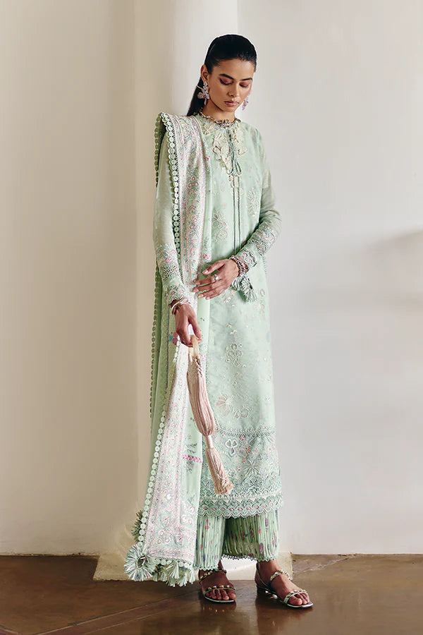 Model wearing pastel mint green embroidered dress from Suffuse Casual Pret 2025 Naire. Pakistani luxury pret and Pakistani clothes online in UK.
