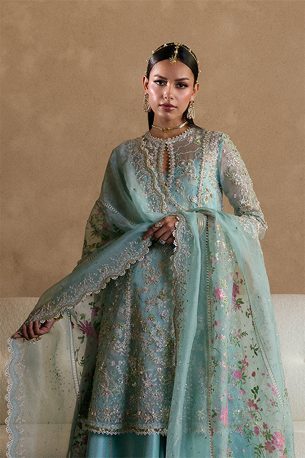 Model wearing aqua blue embellished ensemble from Suffuse Illyra, Pakistani luxury pret, shop Pakistani clothes online in UK