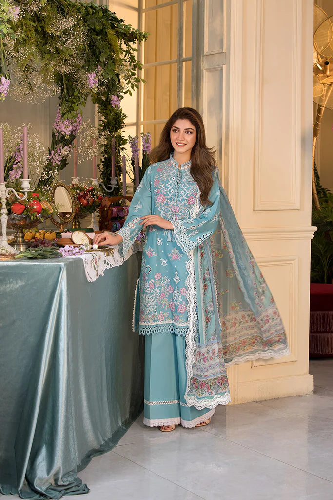 Model wearing teal blue embroidered dress from Sobia Nazir Vital 2025 Design 3A. Pakistani luxury pret and Pakistani clothes online in UK.