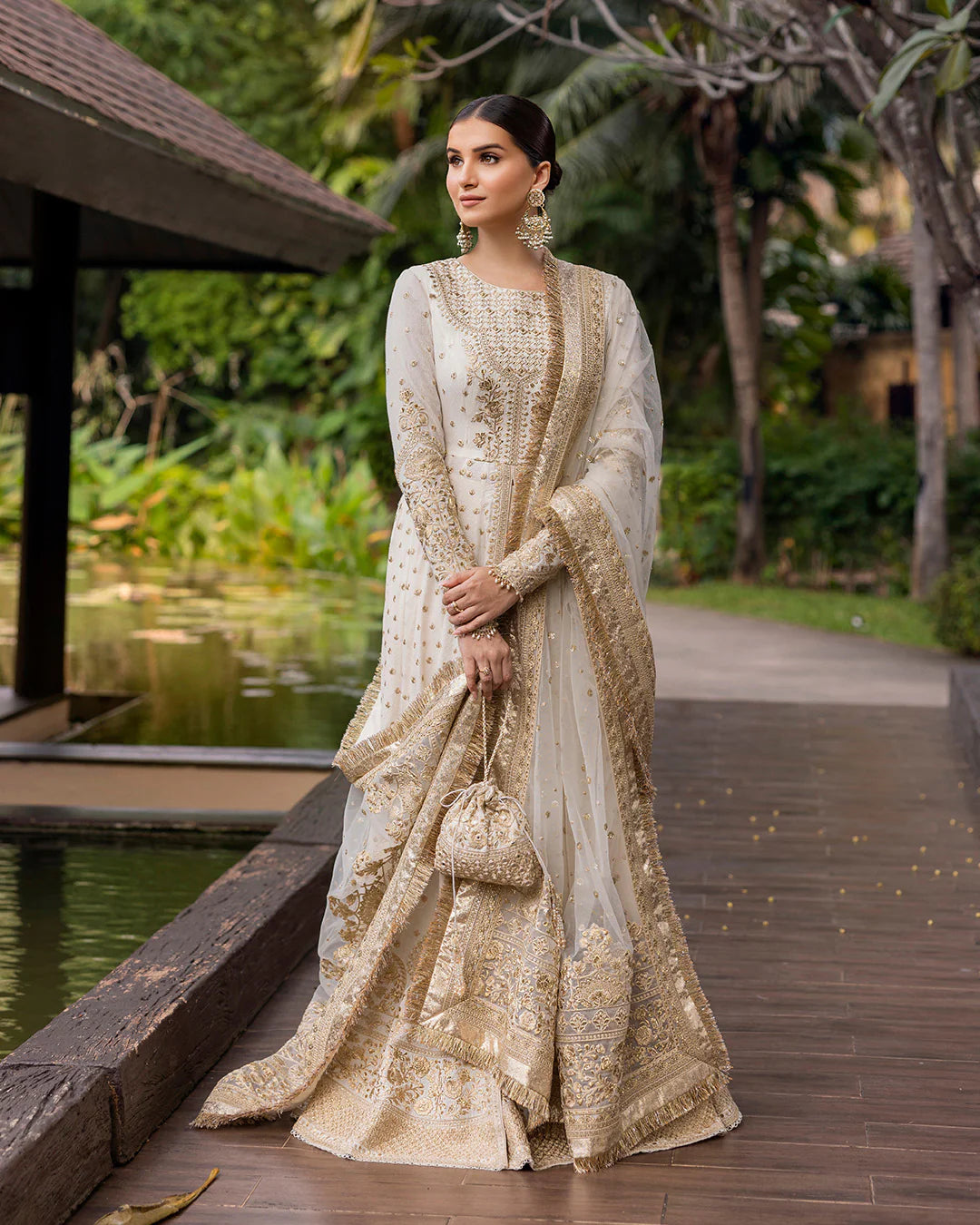 Model wearing ivory gold Lily dress from Faiza Saqlain Zinnia collection, Pakistani Luxury pret, Faiza Saqlain Pakistani clothes online in UK.