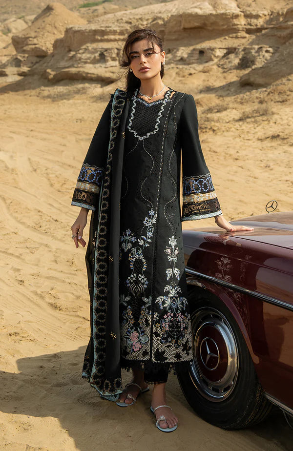 Model wearing black embroidered dress with detailed sleeves and dupatta from Soraya Noa Summer Casual Pret 2025 Mavro. Pakistani clothes online UK.