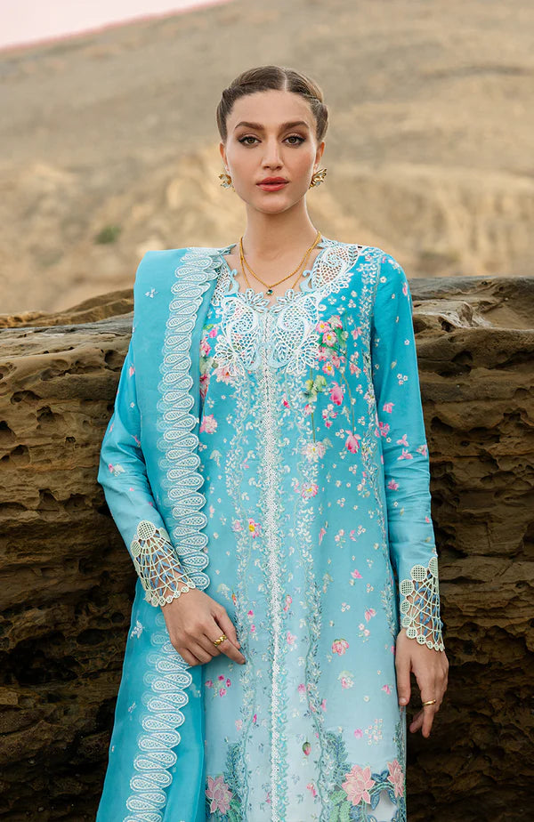 Model wearing aqua blue embroidered dress with white trousers and printed dupatta from Soraya Noa Summer Casual Pret 2025 Serenade. Pakistani luxury pret UK.