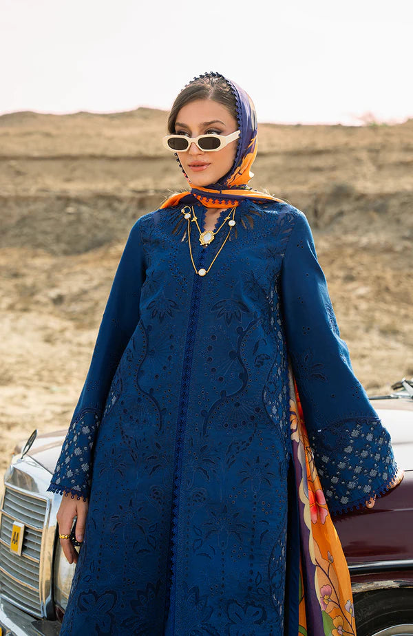 Model wearing royal blue embroidered dress with floral dupatta from Soraya Noa Summer Casual Pret 2025 Azul. Pakistani luxury pret in UK.