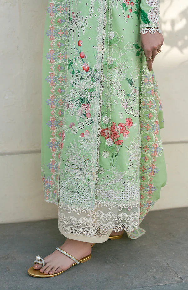 Model wearing mint green embroidered dress with floral detailing and lace hem from Soraya Noa Summer Casual Pret 2025 Willow. Pakistani clothes online UK.
