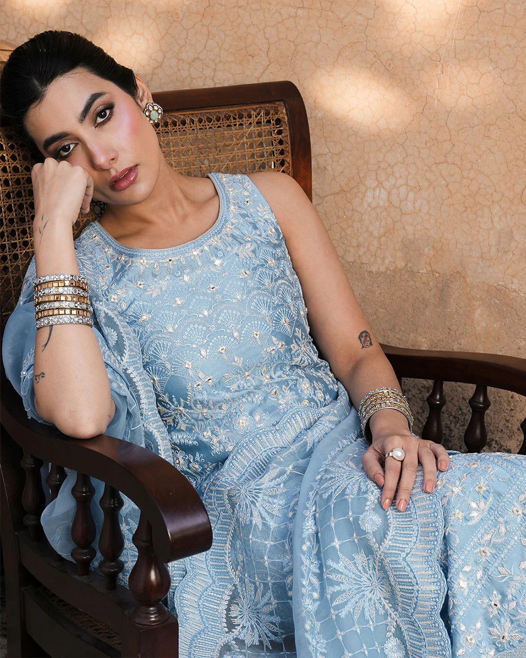 Model wearing powder blue Faiza Saqlain Yulia outfit with intricate embroidery and scalloped dupatta, ideal for Pakistani luxury pret in UK.