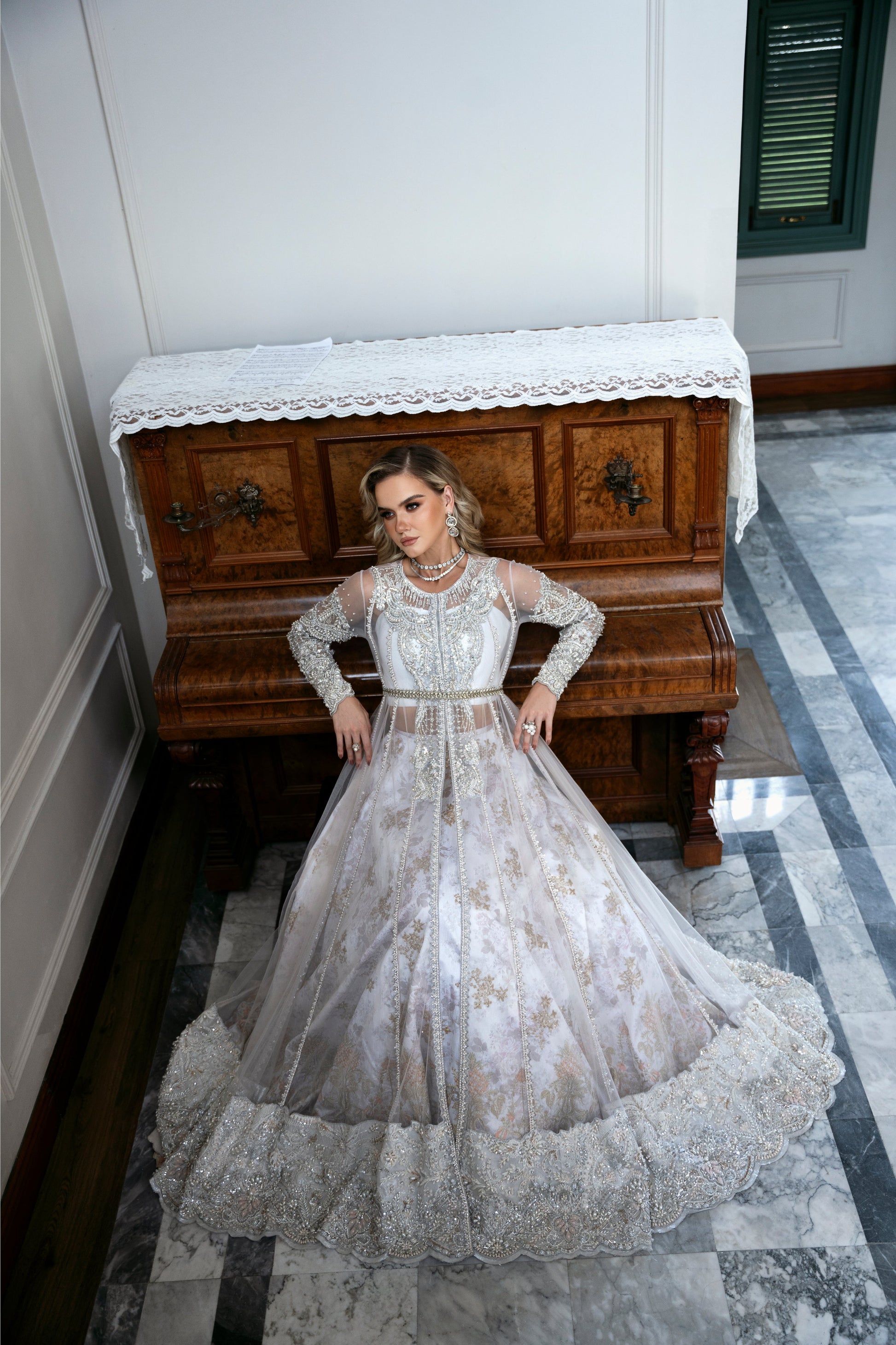 Model wearing Snowdrop from Mysie by Tahira, a stunning white and silver luxury pret outfit, perfect for Pakistani clothes in the UK.