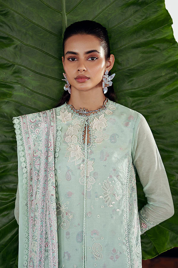 Model wearing pastel mint green embroidered dress from Suffuse Casual Pret 2025 Naire. Pakistani luxury pret and Pakistani clothes online in UK.