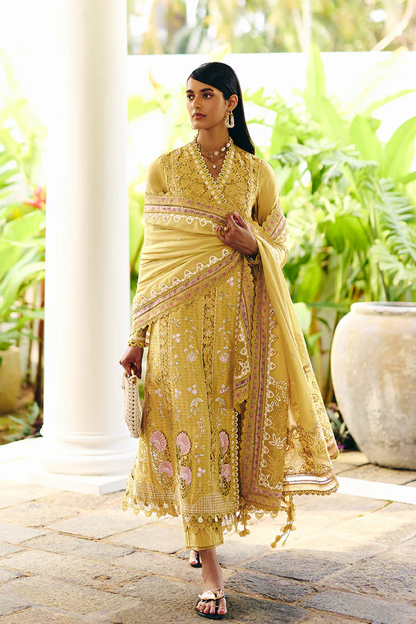 Model wearing mustard yellow embroidered dress from Suffuse Casual Pret 2025 Zorah. Pakistani luxury pret and Pakistani clothes online in UK.