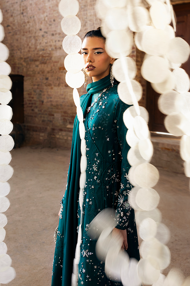 Model wearing SOLARA, three-quarter view, a Pakistani designer outfit by Suffuse, available online in the UK.