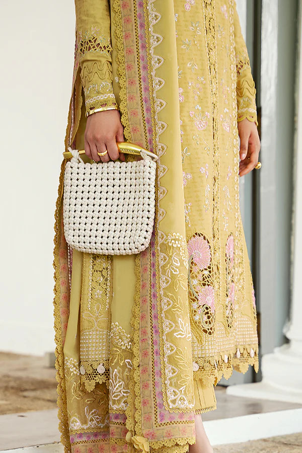 Model wearing mustard yellow embroidered dress from Suffuse Casual Pret 2025 Zorah. Pakistani luxury pret and Pakistani clothes online in UK.