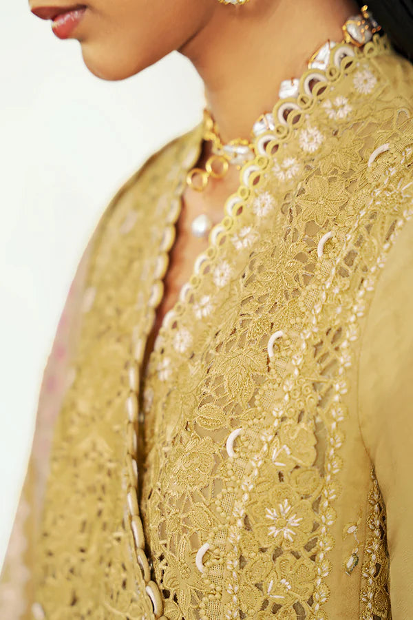 Model wearing mustard yellow embroidered dress from Suffuse Casual Pret 2025 Zorah. Pakistani luxury pret and Pakistani clothes online in UK.