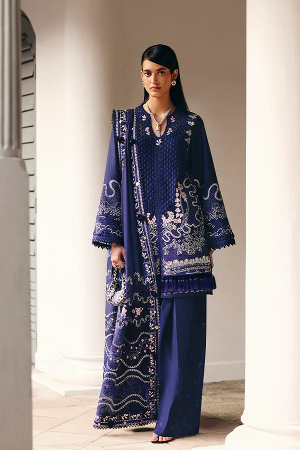 Model wearing deep navy blue embroidered dress with intricate detailing from Suffuse Casual Pret 2025 Sahra. Pakistani luxury pret in UK.